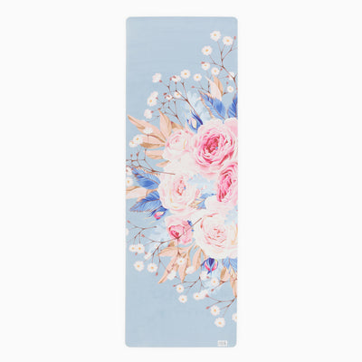 wildbloom everyday yoga mat. pastel blue background with white and pink roses and daisies